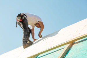 a roofer working
