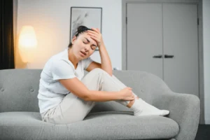 injured woman on couch