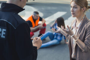 A woman talking to a police officer